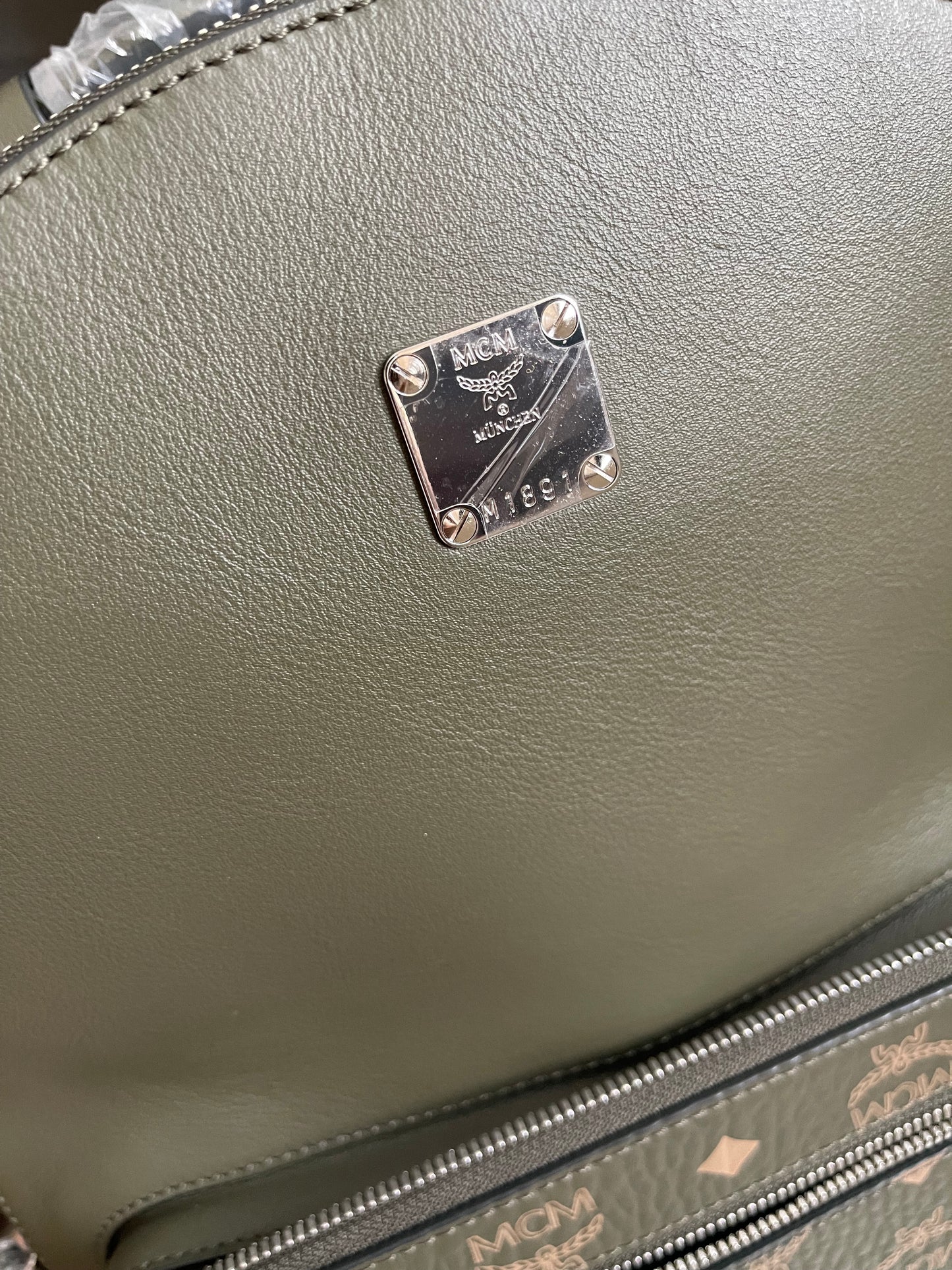Preloved MCM Stark Leather Backpack in SEA TURTLE