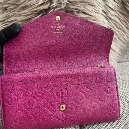 Preloved Authentic Louis Vuitton Monogram Empreinte Sarah Wallet – Fuchsia
