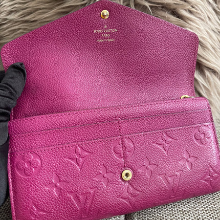 Preloved Authentic Louis Vuitton Monogram Empreinte Sarah Wallet – Fuchsia