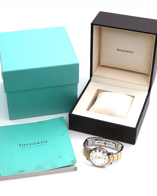 Preloved Authentic Rank A Tiffany Atlas Dome TIFFANY & Co. Tiffany Atlas Dome Z1810.68.15A21A00A, 50m Water Resistant, Date Display, See-Through Back, Silver, Stainless Steel, and Yellow Gold, Men's Automatic Watch