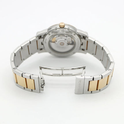 Preloved Authentic Rank A Tiffany Atlas Dome TIFFANY & Co. Tiffany Atlas Dome Z1810.68.15A21A00A, 50m Water Resistant, Date Display, See-Through Back, Silver, Stainless Steel, and Yellow Gold, Men's Automatic Watch