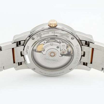 Preloved Authentic Rank A Tiffany Atlas Dome TIFFANY & Co. Tiffany Atlas Dome Z1810.68.15A21A00A, 50m Water Resistant, Date Display, See-Through Back, Silver, Stainless Steel, and Yellow Gold, Men's Automatic Watch