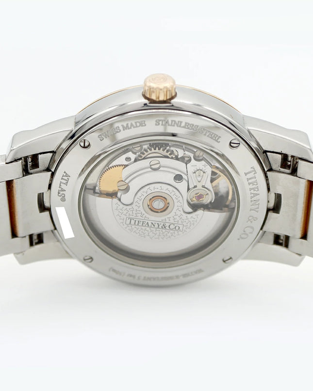 Preloved Authentic Rank A Tiffany Atlas Dome TIFFANY & Co. Tiffany Atlas Dome Z1810.68.15A21A00A, 50m Water Resistant, Date Display, See-Through Back, Silver, Stainless Steel, and Yellow Gold, Men's Automatic Watch