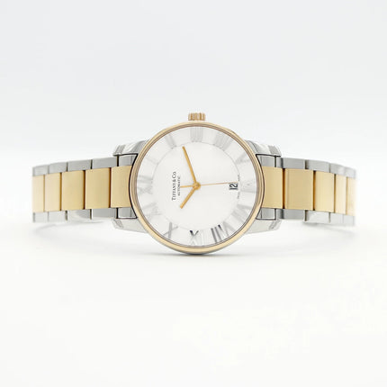 Preloved Authentic Rank A Tiffany Atlas Dome TIFFANY & Co. Tiffany Atlas Dome Z1810.68.15A21A00A, 50m Water Resistant, Date Display, See-Through Back, Silver, Stainless Steel, and Yellow Gold, Men's Automatic Watch