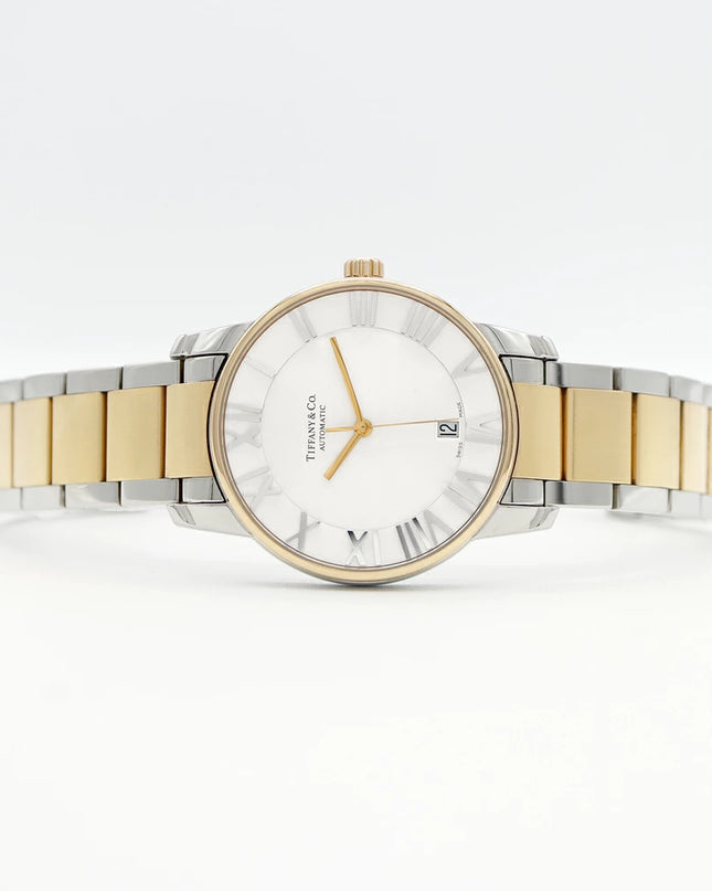 Preloved Authentic Rank A Tiffany Atlas Dome TIFFANY & Co. Tiffany Atlas Dome Z1810.68.15A21A00A, 50m Water Resistant, Date Display, See-Through Back, Silver, Stainless Steel, and Yellow Gold, Men's Automatic Watch