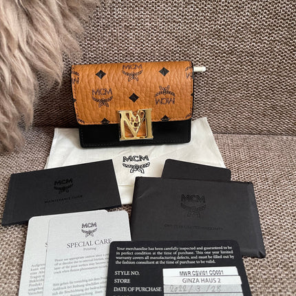 Preloved Authentic MCM Mena Trifold Wallet – Cognac Visetos