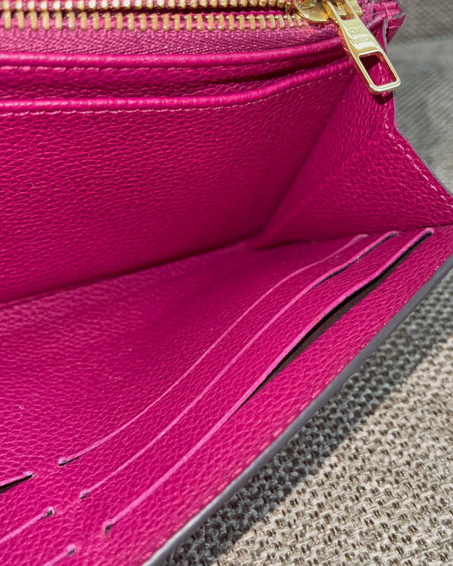 Preloved Authentic Louis Vuitton Monogram Empreinte Sarah Wallet – Fuchsia