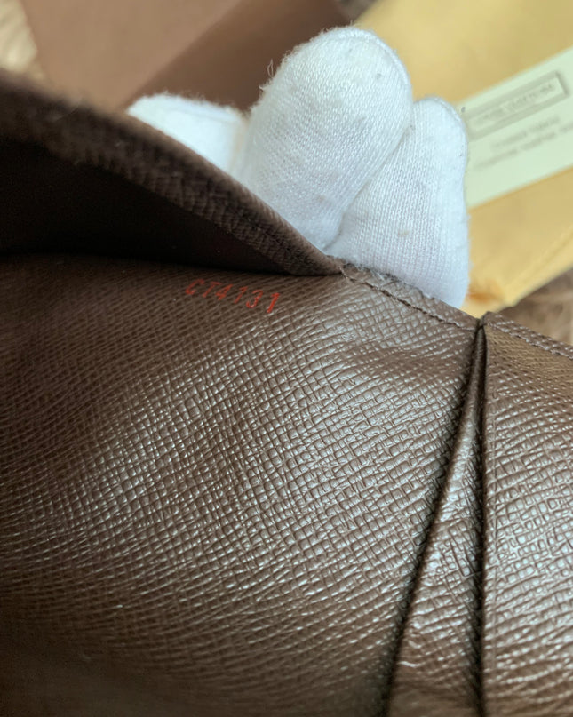 LOUIS VUITTON
Damier Ebene Canvas Pocket Organizer