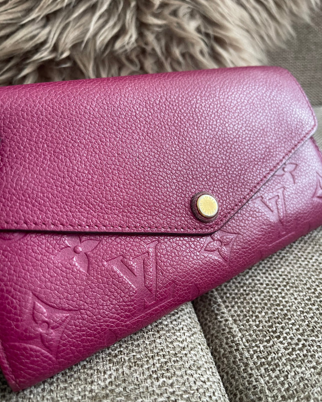 Preloved Authentic Louis Vuitton Monogram Empreinte Sarah Wallet – Fuchsia