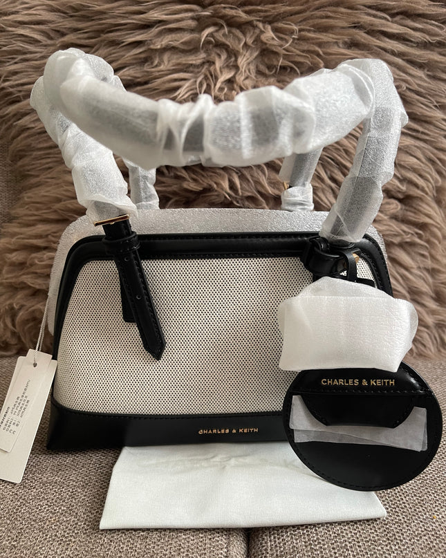 Preloved Authentic Charles & Keith Structured Boston Bag in Black White Mesh